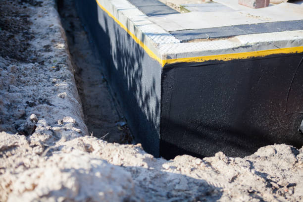 Professional Emergency Waterproofing technician working in Rossville, MD